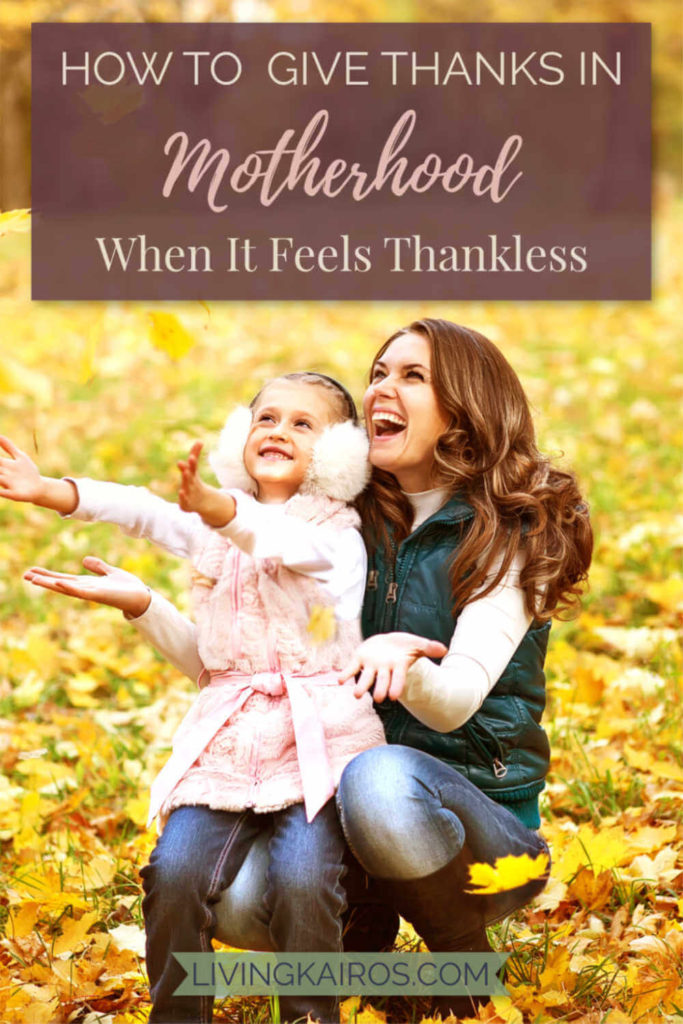 Mother and Daughter Playing in Fall Leaves. Learn to give thanks in motherhood