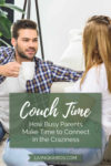 A couple sitting on a couch talking with mugs | Couch Time